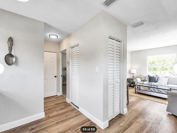 Bright living room- blinds not shown
2 storage closets
hardwood floors