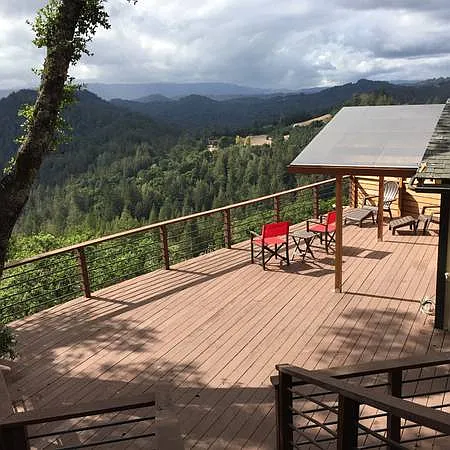 Deck with view taken from steps to parking area.
