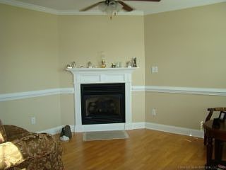 Formal living room with fireplace and custom flooring