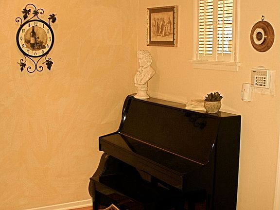 Gleaming hardwood floors & crown accent molding