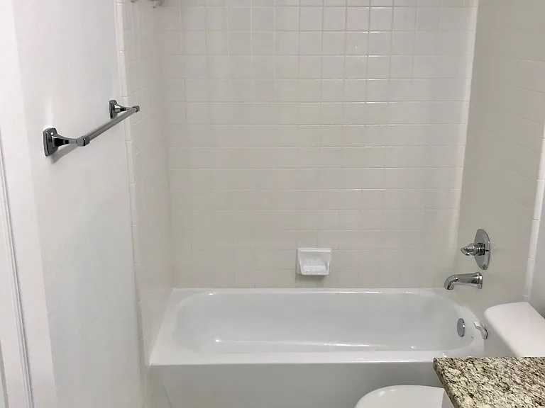 Guest bathroom with Delta shower and faucets and Kohler brand toilet and sink