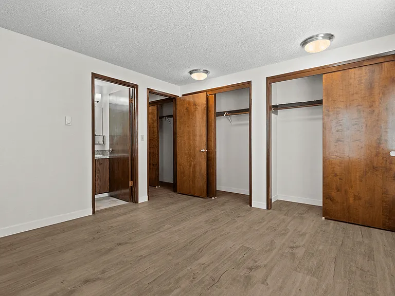Bedroom with ample closet space and easy bathroom access Bedroom with ample closet space and easy bathroom access