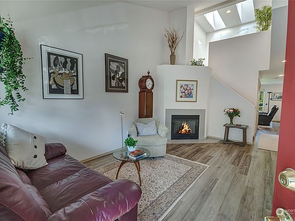 Enter into a spacious, living room with tons of natural light!>