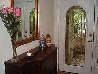 Hardwood entry with leaded glass door and side lights