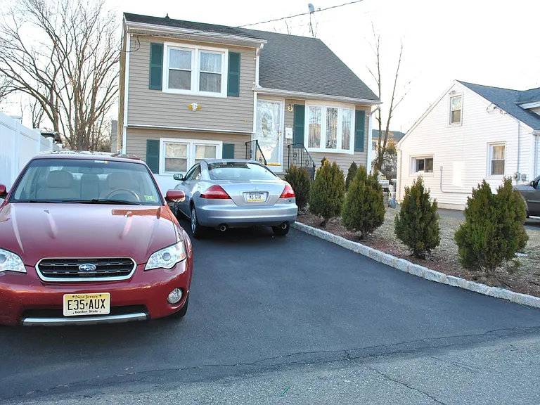 2 cars width drive way to park 4 cars.