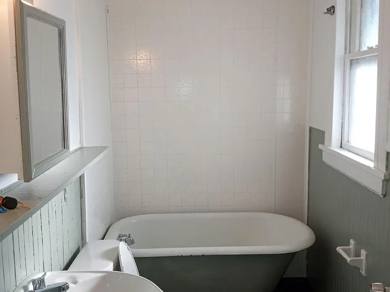 Traditional Bathroom with claw foot deep tub. Shower hook up has been added since photo was taken