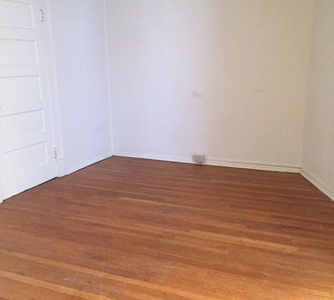 Bedroom area with beautiful hardwood floors!