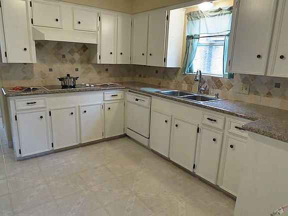 This beautiful kitchen is roomy with new granite counter tops