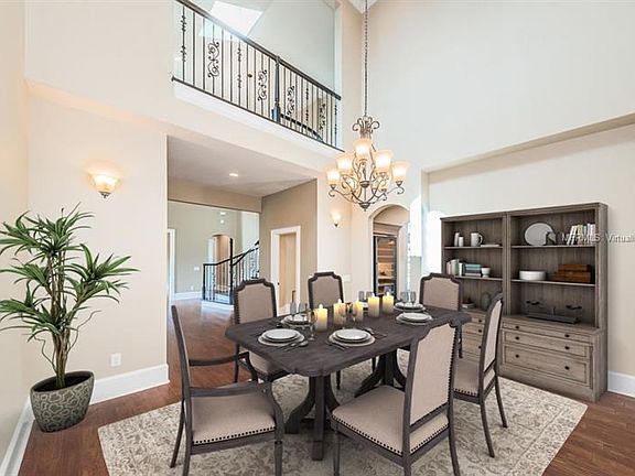 Virtually staged photo of dining room.