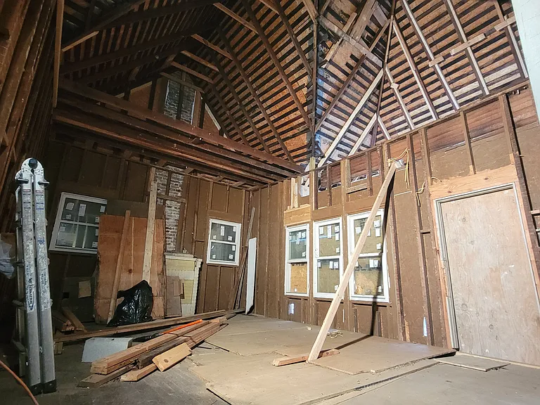 This was the living room a few months ago. Now it is all tightly insulated, with framing perfect, elegant custom replica trim and new sheetrock.
