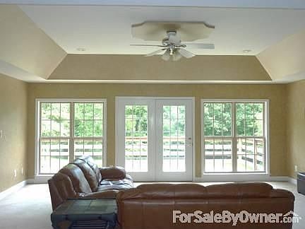 Huge great room with tray ceiling and lots of light