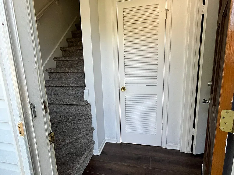Entrance to home with coat closet