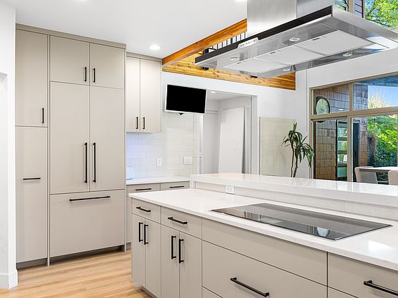 Kitchen with Panelized Refrigerator and Induction Cooktop.