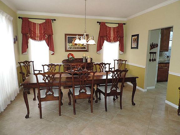 Elegant Formal dining with Designer Paints *Tile Floors all Open to Entry & Den!