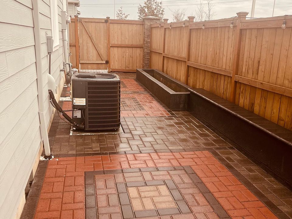 Paved side yard. With a space to grow your own plant & herbs