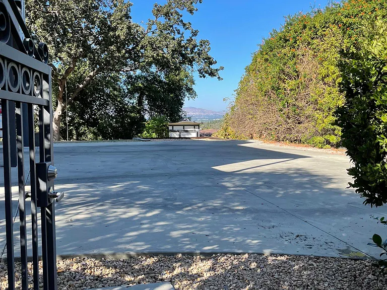 1 gated and covered parking spot to entrance of patio and unit