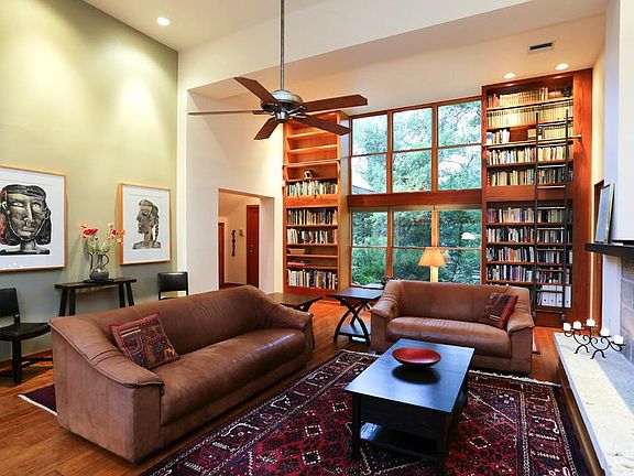 Four sets of full height bookshelves and custom library ladder.