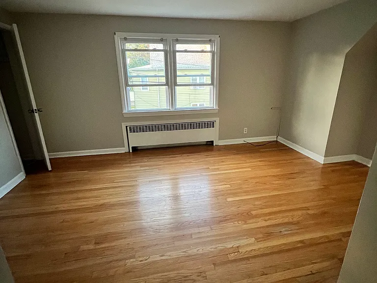 Living room w/ one closet