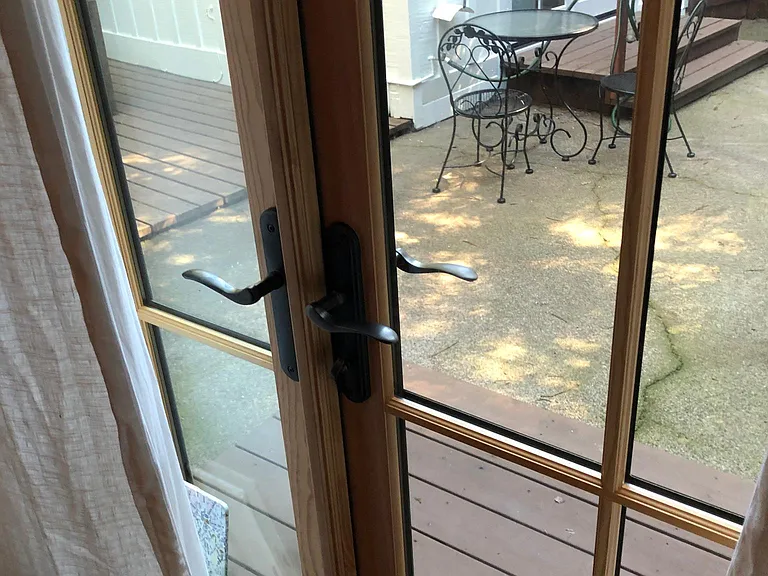 Bedroom Marvin French door leading onto concrete patio