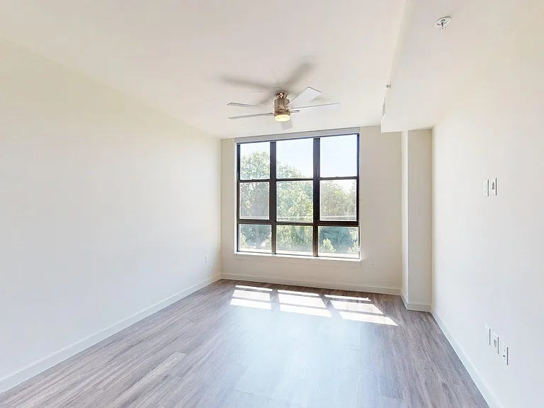 Apartment living room with wood style floor.