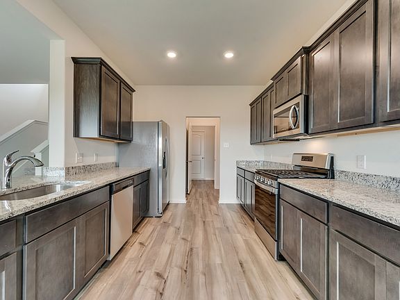 The kitchen comes with a full suite of energy-efficient appliances