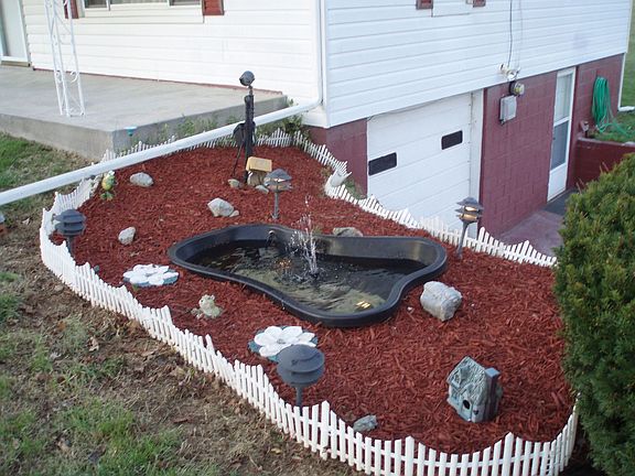 Flower bed with small pond