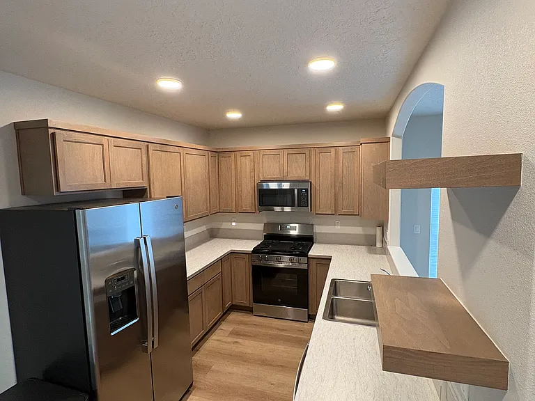 Kitchen with gas stove. Brand new appliances.