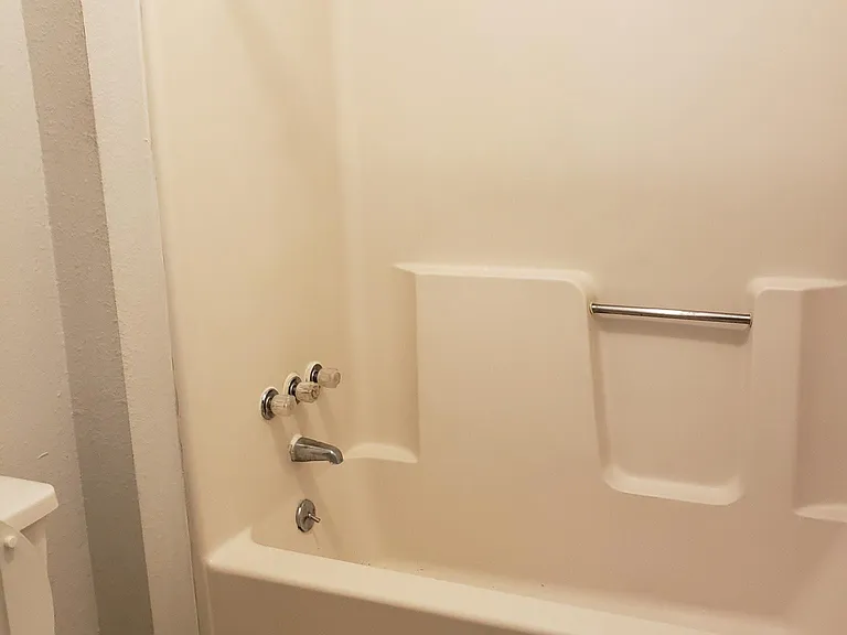 Part of the full bathroom upstairs showing the toilet & bathtub room.