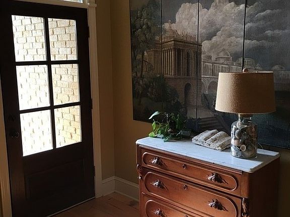 Entry
						:
						2 Story exterior covered entry, w/ 6 pane Colonial wood door and transom