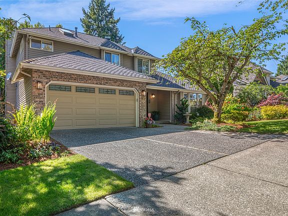 Notice the exterior brick accent garage wall. Garage door is fully insulated with windows for light; updated in 2019.