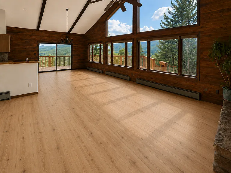 Views, views, views, and brand new Luxury Vinyl Plank (LVP) Flooring. Photo is digitally altered to show flooring and ceiling fan updates (original photos were taken prior to the floors and ceiling install).