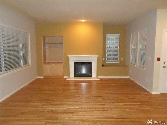 Living room with builtins and gas fireplace