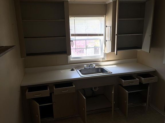 view of kitchen cabinets and sink