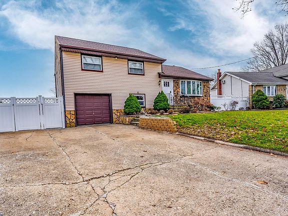 1 car garage with two car width driveway for up to 4 driveway parking spaces.