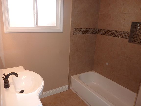 All new tile, tub, fixtures and plumbing