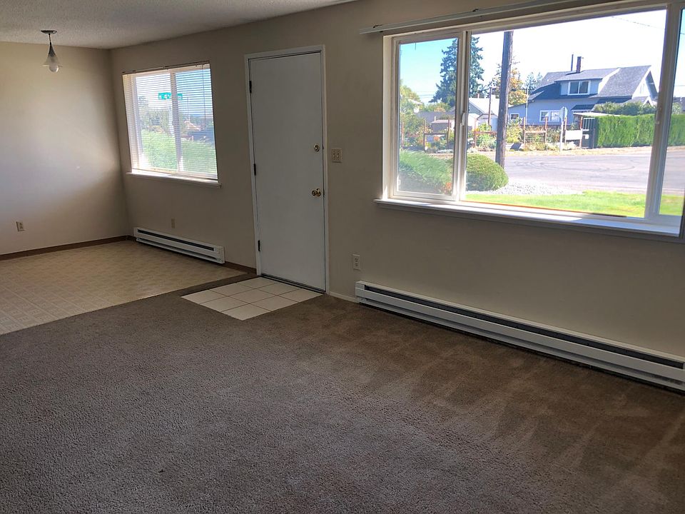 Dining area, front door, and living room window.
