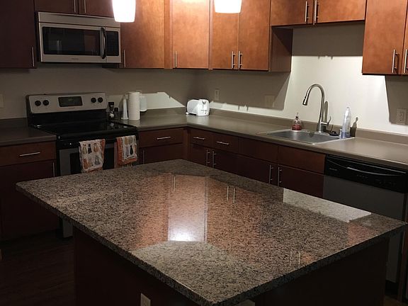 bright and spacious kitchen with granite island