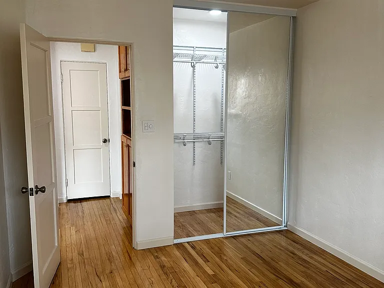 Bedroom Closet:
Recessed Lighting
Adjustable Wire Shelves
Long Sliding Mirror Closet Doors