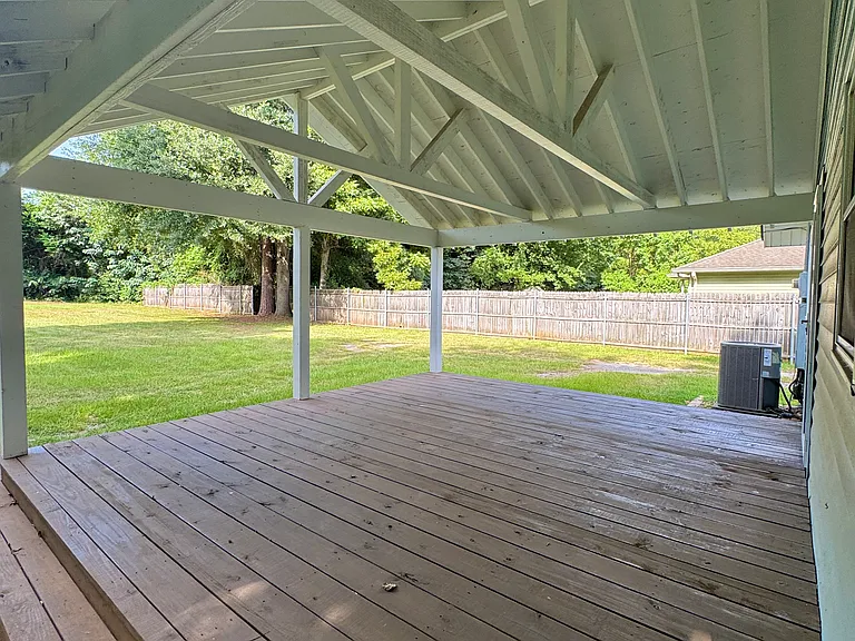 Back Porch & Partially Fenced Backyard