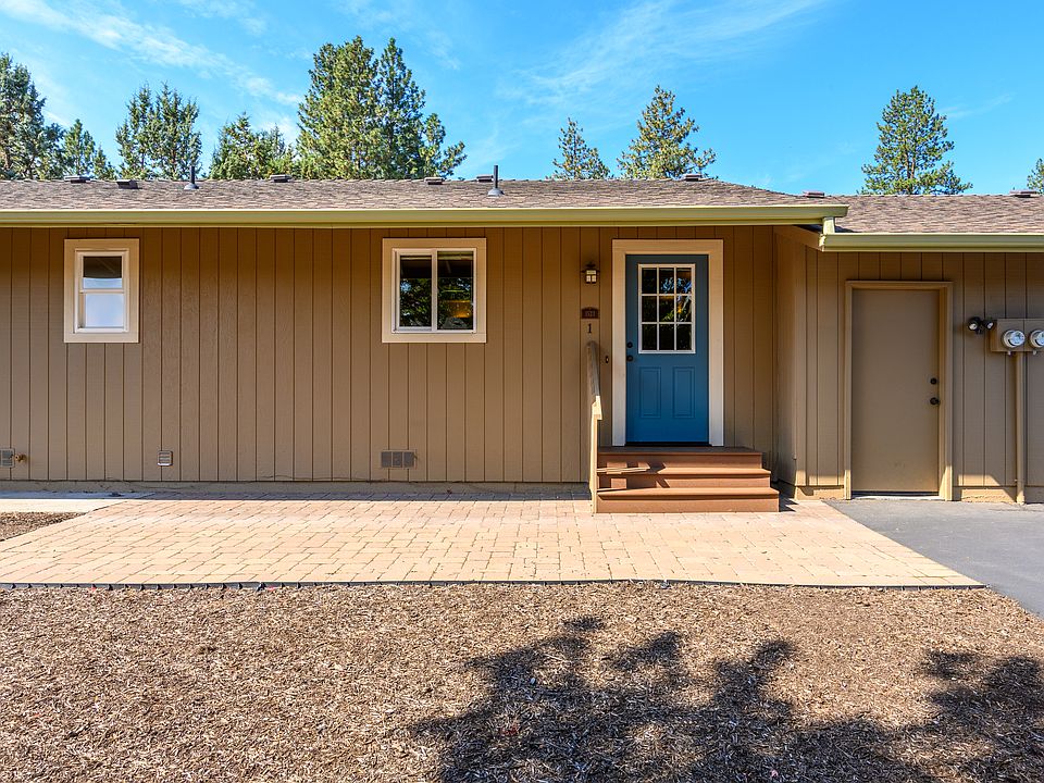Front door next to attached garage