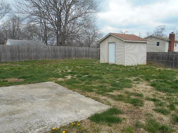 Fenced back yard, patio and two storage sheds