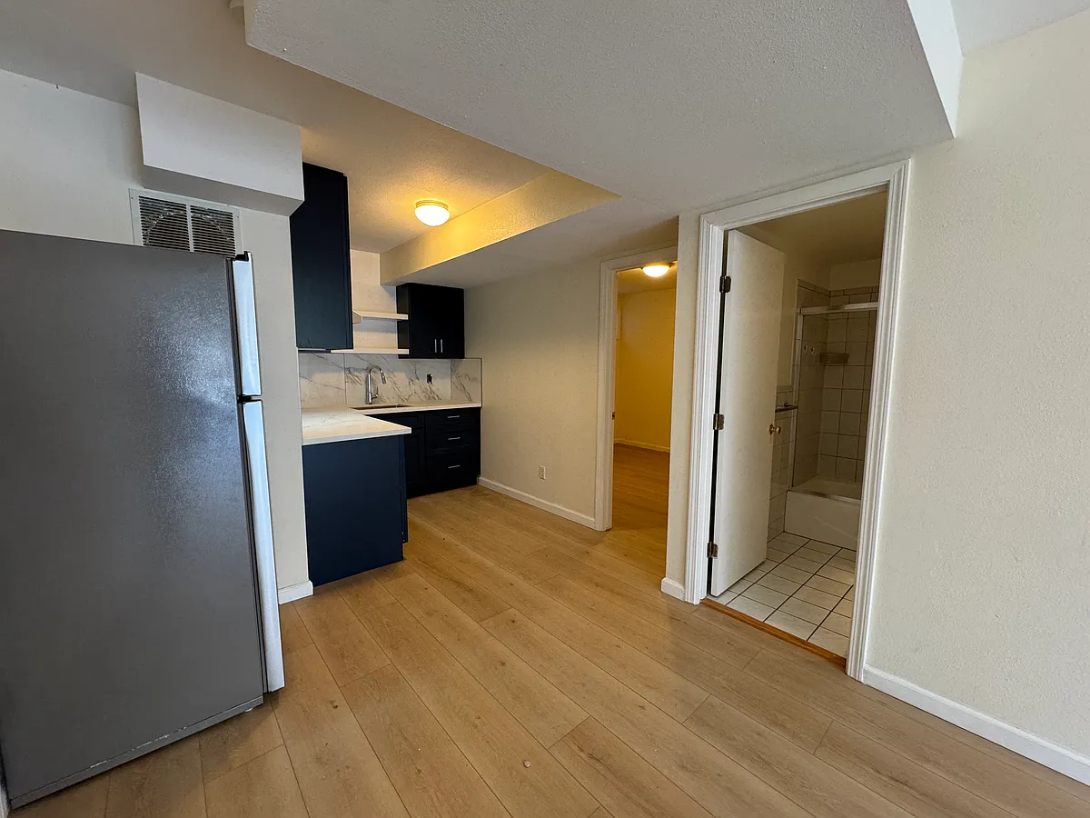 Entrance to this lower unit. Kitchen on the left and living /dining room combo on. the right. 2 bedrooms separated by full bath in the middle - 444 Ralston St #A