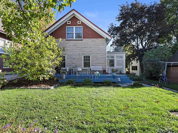 Exterior side view (deck now painted to match brick)