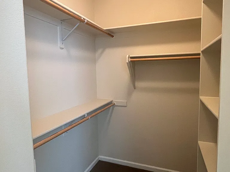 Walk in closet in primary suite.