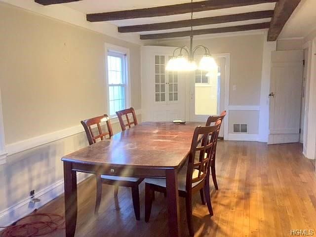 Huge Dining room with original post and beam ceiling and bui
