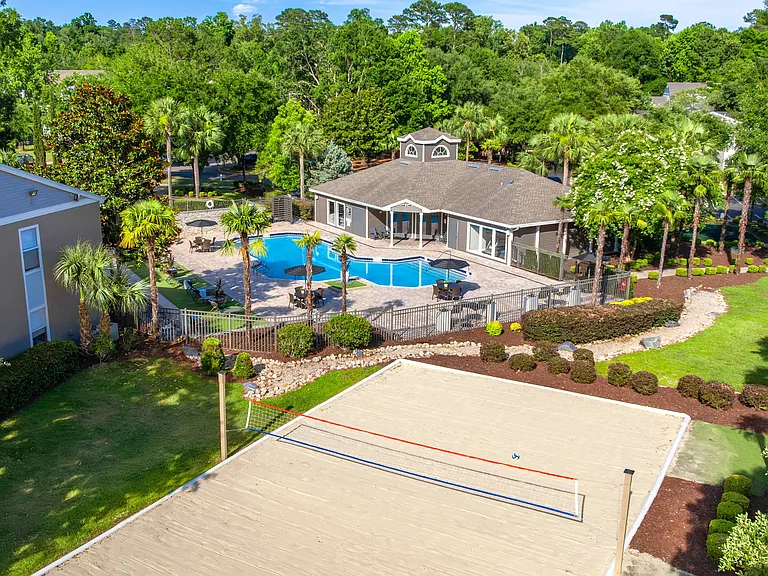 From competitive volleyball matches to poolside lounging, this aerial view captures the energy and beauty of life at Oasis at 1800.