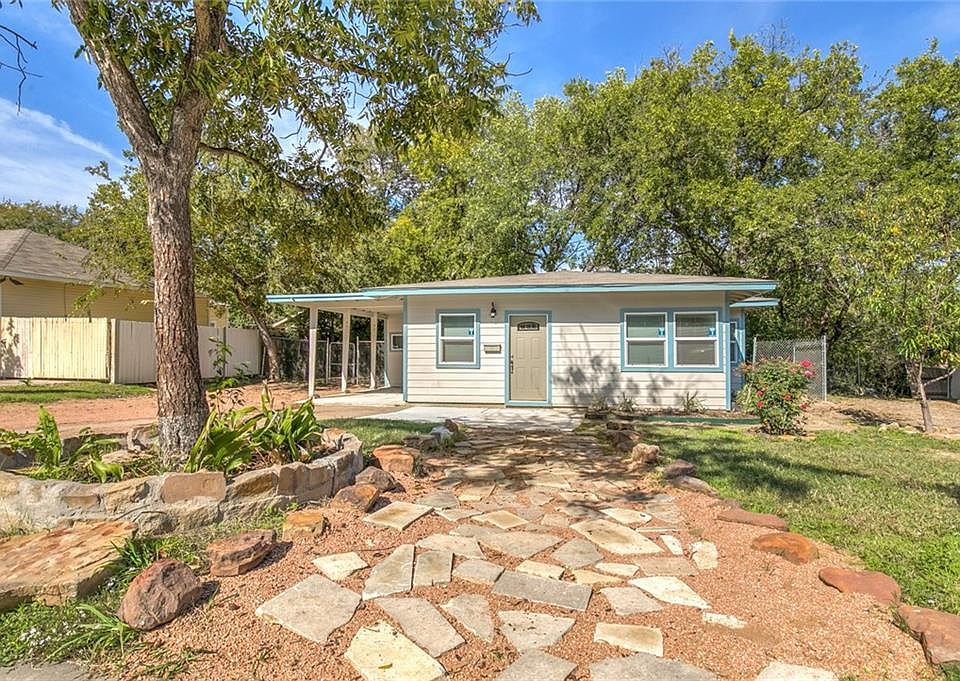 Beautiful exterior with great tree coverage in the back.