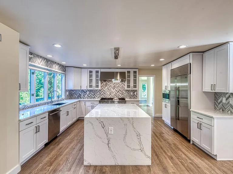 All high end appliances and waterfall kitchen island