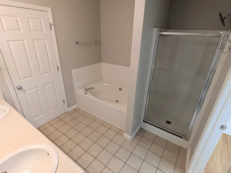 Bathroom 1 with dual sink, shower and soaker tub