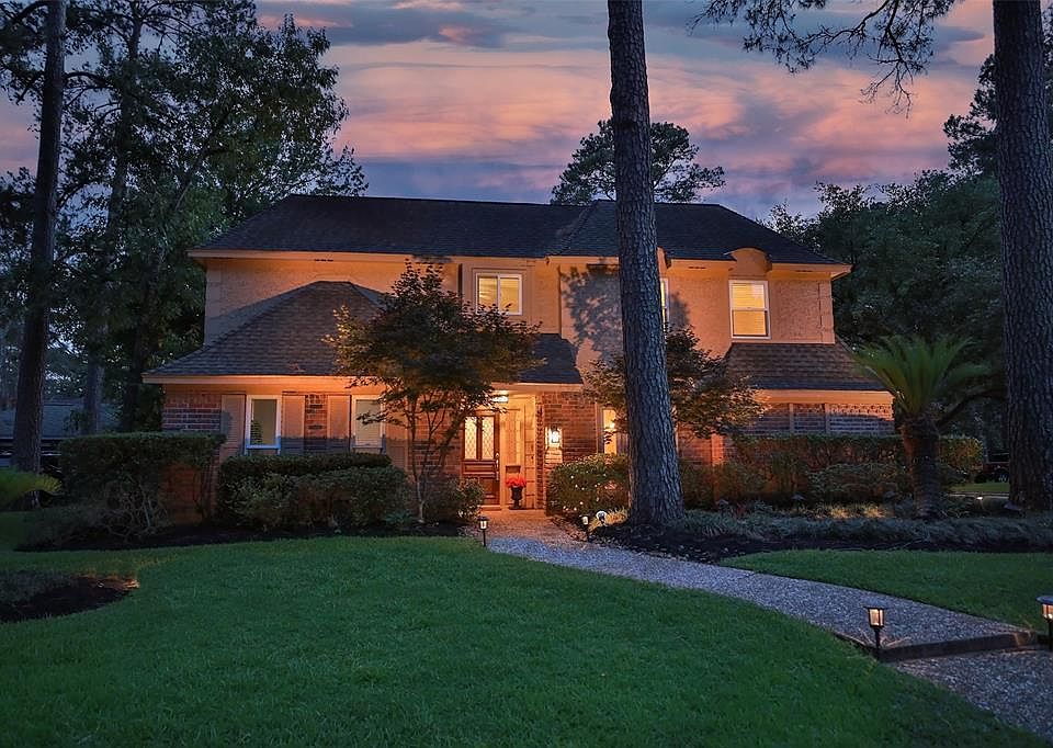 BEAUTIFULLY SITUATED ON A CORNER LOT IN CHAMPION FOREST